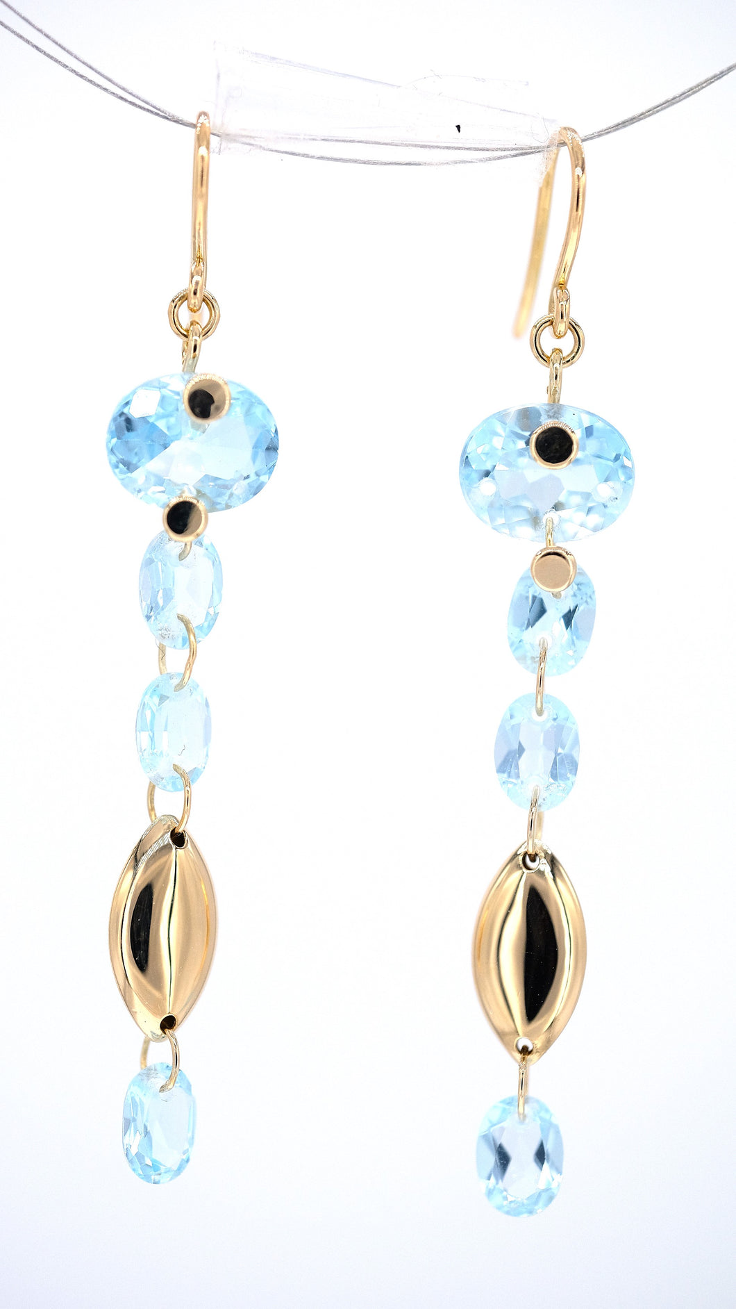 Dangling icy blue topaz